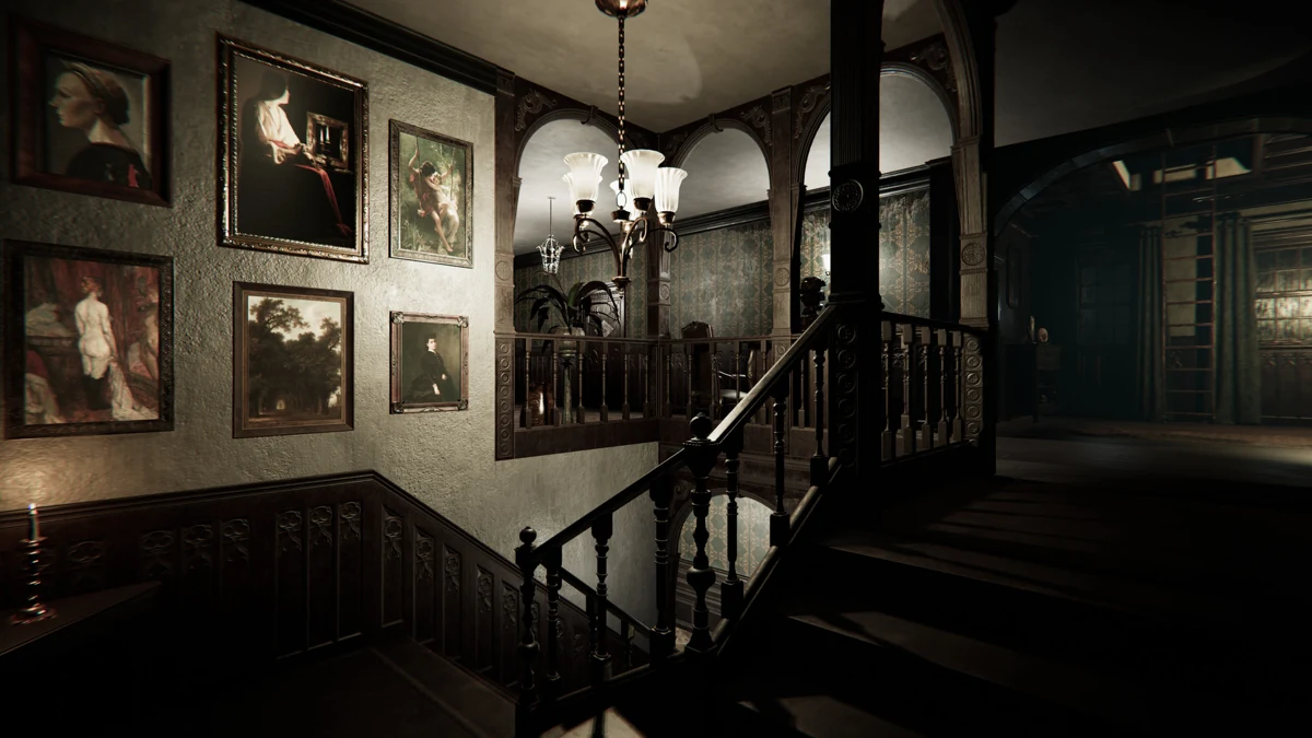 A portrait-lined staircase inside the manor.