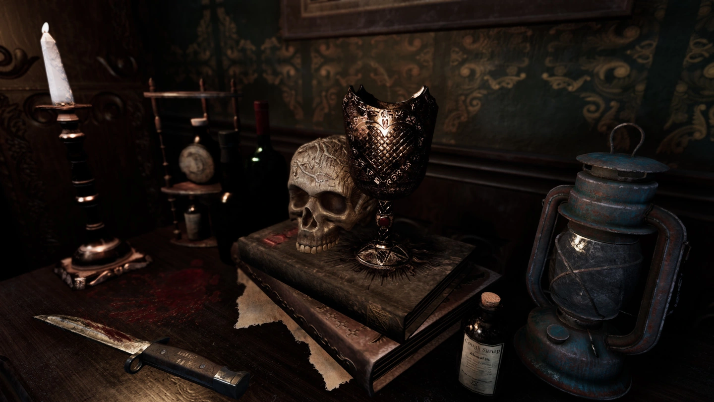 A skull, ornate chalice, knife, candle and old lantern sit on a crowded ritual table.