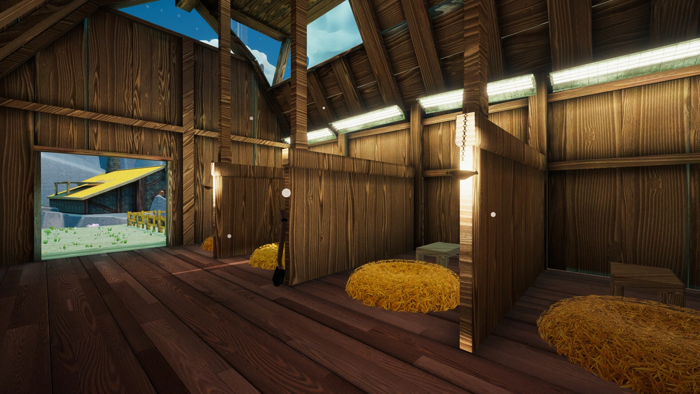 An empty barn contains hay bales, a shovel, beams and hanging lights.